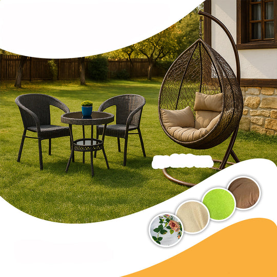 Outdoor furniture set with chairs, table, and hanging egg chair on a grassy area.
